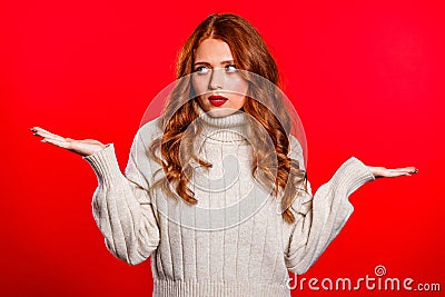 Can`t help anything .Young millenial woman on red background Stock Photo