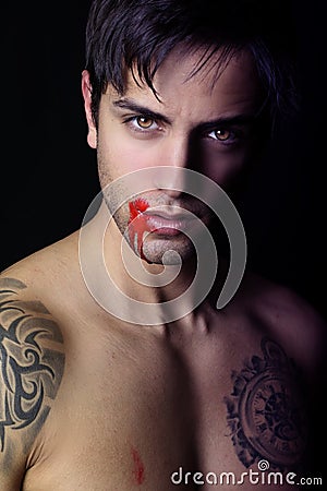 Young Vampire Whith Blood Flowing Lips Stock Photo