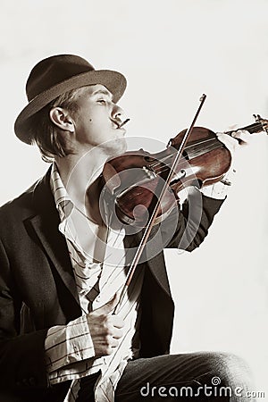 Young violinist playing to violin Stock Photo