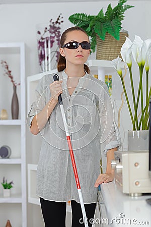 Young visually impaired woman at home Stock Photo