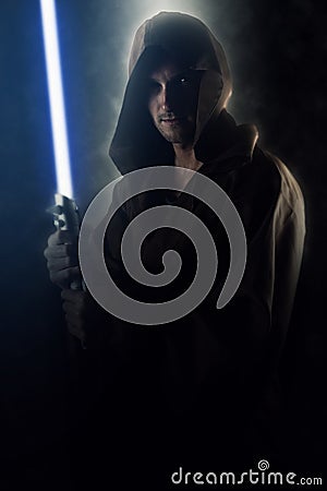 Young warrior holding a lightsaber Stock Photo