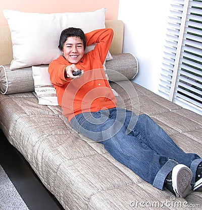 Young watching TV al home Stock Photo