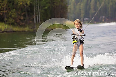 Young Waterskier on a beautiful scenic lake Stock Photo