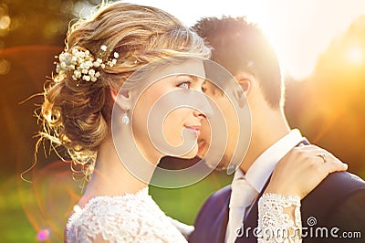 Young wedding couple on summer meadow Stock Photo