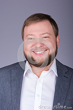 Young were fat man with a beard. A broad smile Stock Photo