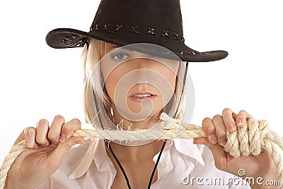 Young western girl with a hat and a rope Stock Photo