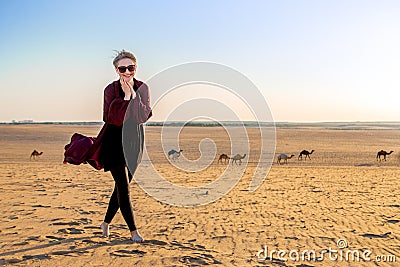 Young woman with abaya in the Salisil desert in Saudi Arabia Stock Photo