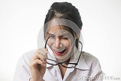 Young woman accidentally stab her eye with glasses leg, show painful and scream out emotional, funny accident Stock Photo