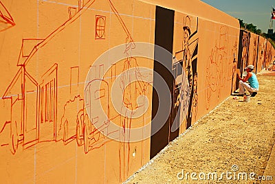 Painting a mural along Interstate 35 in Denton, Texas Editorial Stock Photo