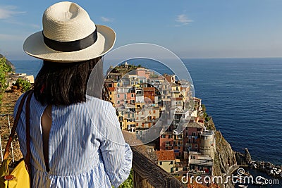 A young woman admires Manarola landscape Editorial Stock Photo