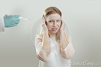 Young woman afraid of needles Stock Photo