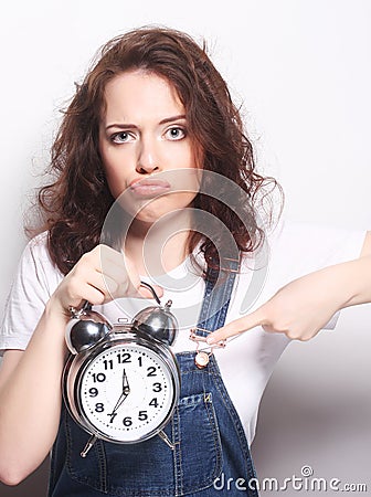 Young woman with alarmclock Stock Photo