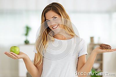 Young woman with apple and cake Stock Photo