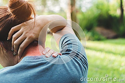 Young woman asian have accident Neck pain in sport exercise jogging, Health and Fitness Concepts, Selective focus Stock Photo