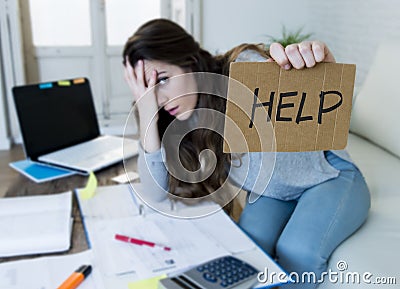 Young woman asking for help suffering stress doing domestic accounting paperwork bills Stock Photo