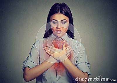 Young woman with asthma attack or respiratory problem Stock Photo