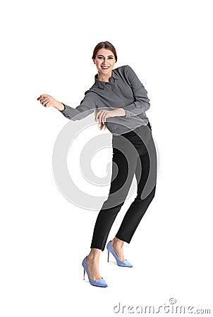 Young woman attracted to magnet on white Stock Photo