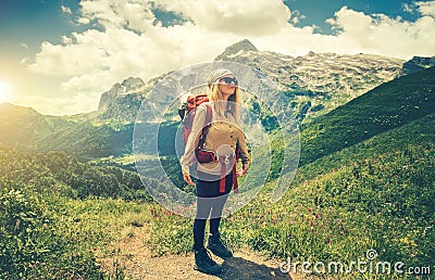 Young Woman with backpack hiking Travel Lifestyle Stock Photo