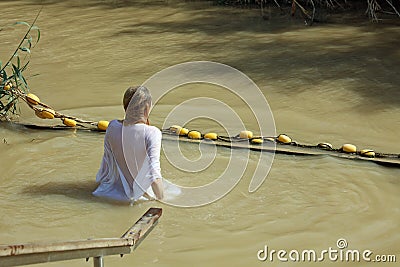 Young Woman at the Baptism Site in Jordan River. Israel Editorial Stock Photo