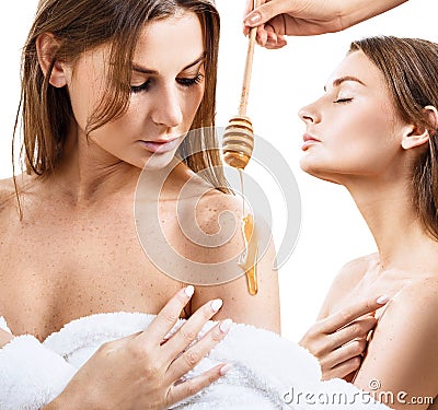 Young woman in bathrobe prepare for honey facial mask. Stock Photo