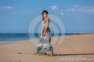 YOUNG WOMAN ON A BEACH Stock Photo