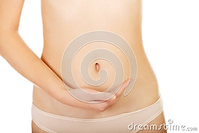 Young woman belly with hand on it Stock Photo