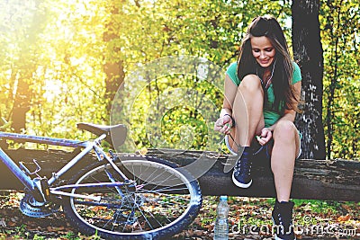 Young woman with bicycle Stock Photo