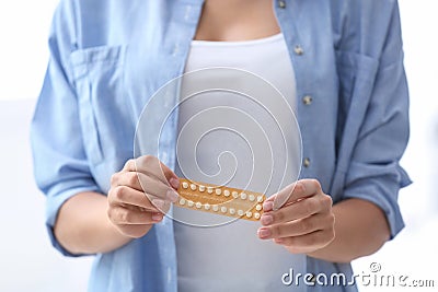 Young woman with birth control pills Stock Photo