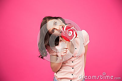 Young woman bitting lollipop Stock Photo