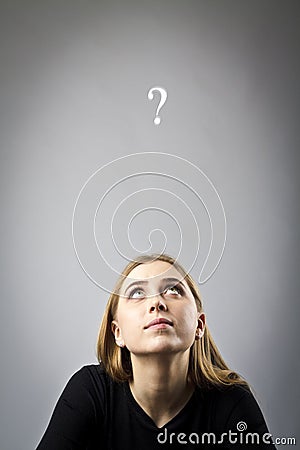 Young woman in black and question mark Stock Photo