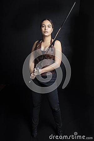 Young woman in urban fantasy poses on a black background Stock Photo