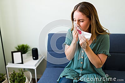 Caucasian woman with a runny nose Stock Photo