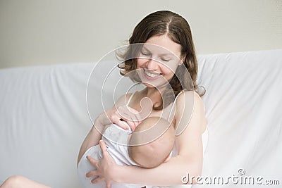 Young woman breastfeeding Stock Photo