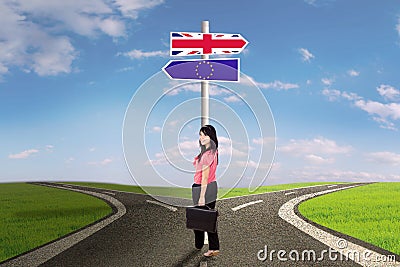 Young woman with brexit signpost Stock Photo