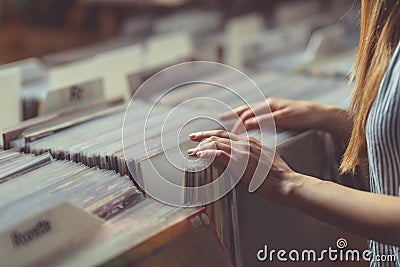 Young woman in a vinyl record store Stock Photo