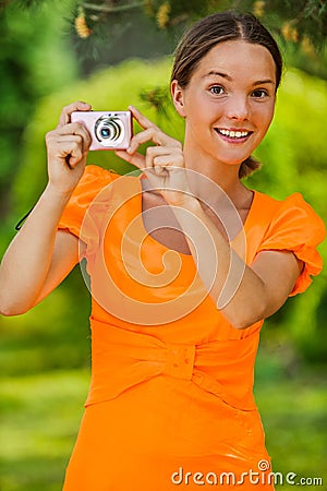 Young woman with camera Stock Photo