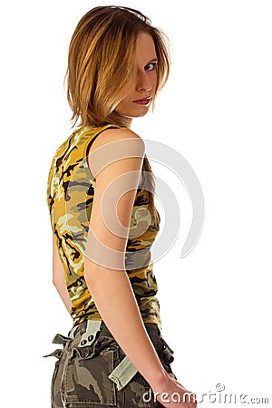 Young woman in camouflage looking over shoulder Stock Photo