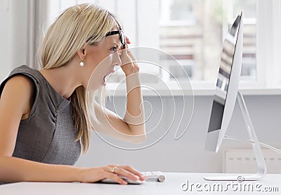 Young woman can't handle that workload anymore. Stock Photo