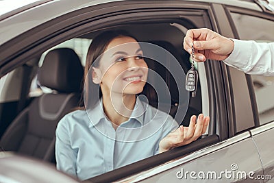 Young Woman in a Car Rental Service Test Drive Concept Stock Photo