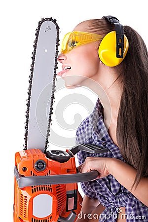 Young woman with a chainsaw Stock Photo