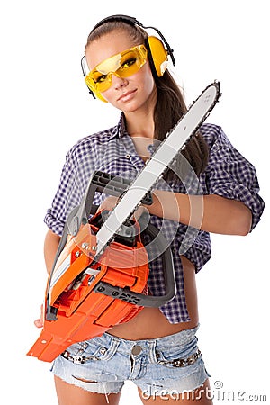 Young woman with a chainsaw Stock Photo