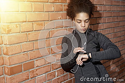 Young woman checking activity tracker Stock Photo
