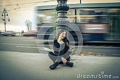 Young woman checking her mobile phone Stock Photo