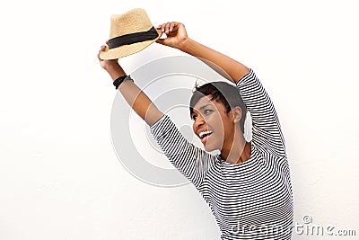 Young woman cheering with arms raised Stock Photo