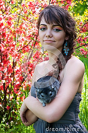Young woman with chinchilla Stock Photo
