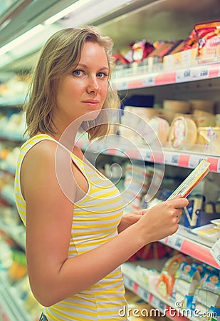 Young woman choosing meat. Stock Photo