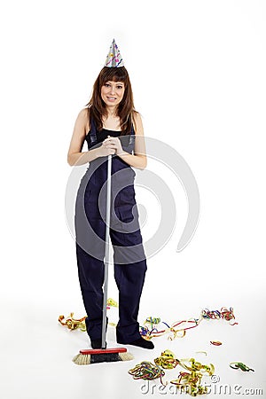 Young woman cleans with broom Stock Photo