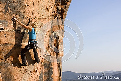 Young woman climbing Stock Photo