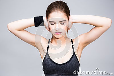Young woman closes her ears with her fingers Stock Photo