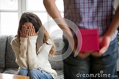 Young woman closing eyes with hands waiting for present surprise Stock Photo